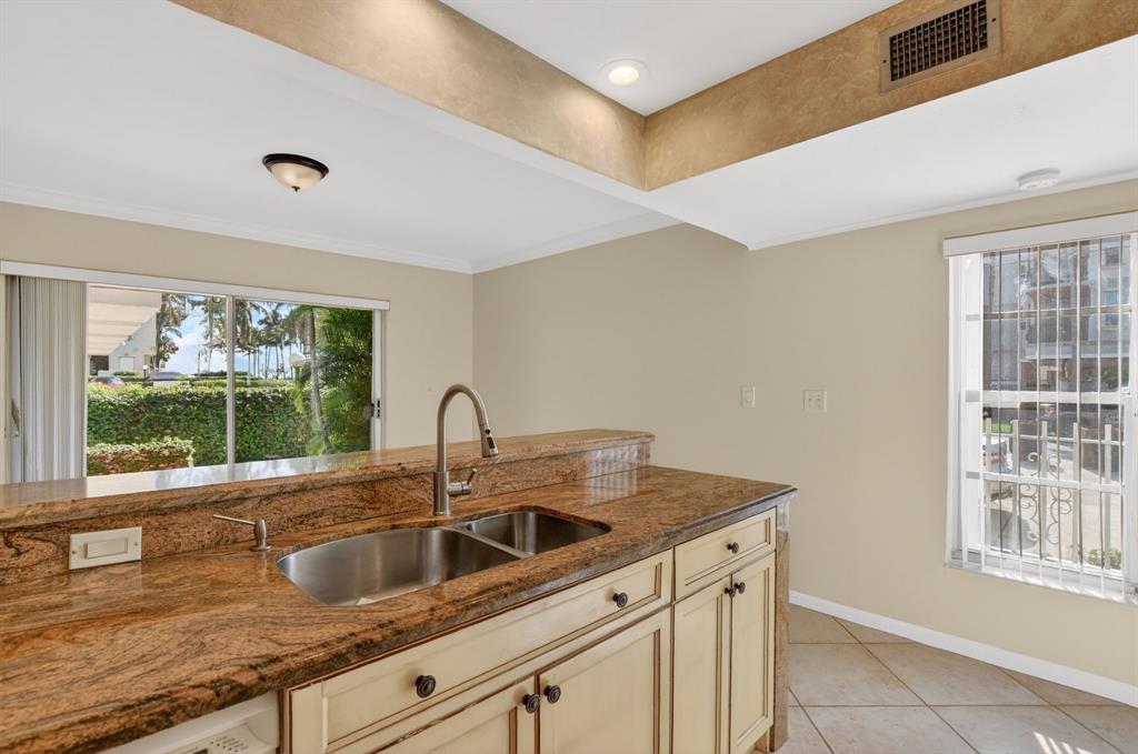 596 Southeast 20th Avenue, Unit 4 Deerfield Beach, FL 33441 - Photo 22 of 51 a kitchen with a sink and a window