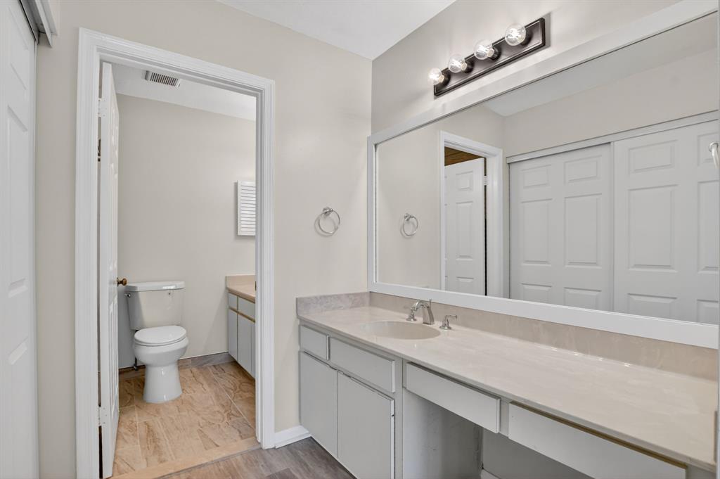 596 Southeast 20th Avenue, Unit 4 Deerfield Beach, FL 33441 - Photo 35 of 51 a bathroom with a sink a toilet and a shower
