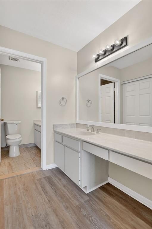 596 Southeast 20th Avenue, Unit 4 Deerfield Beach, FL 33441 - Photo 36 of 51 a spacious bathroom with a double vanity sink and a mirror
