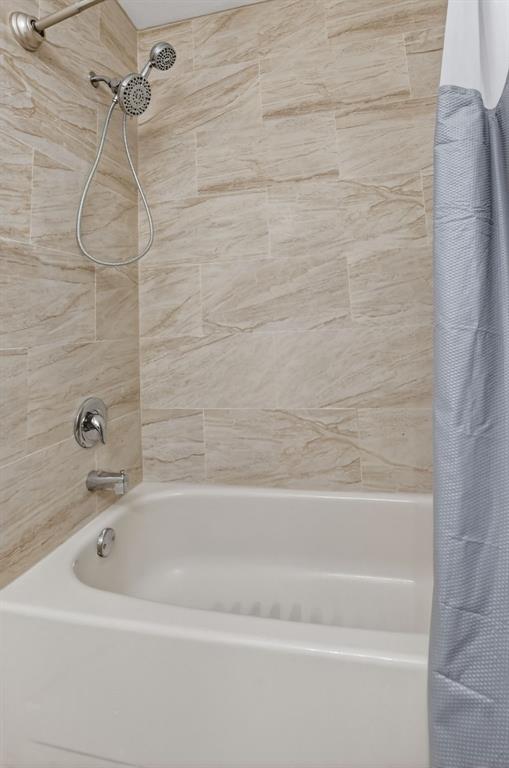 596 Southeast 20th Avenue, Unit 4 Deerfield Beach, FL 33441 - Photo 38 of 51 a bathroom with a bathtub