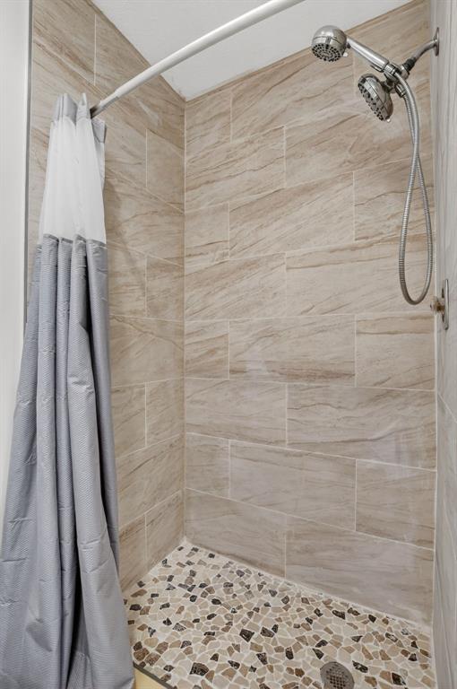 596 Southeast 20th Avenue, Unit 4 Deerfield Beach, FL 33441 - Photo 46 of 51 a bathroom with a shower