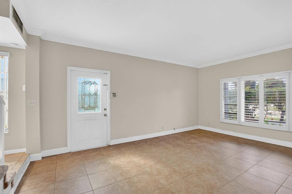 596 Southeast 20th Avenue, Unit 4 Deerfield Beach, FL 33441 - Photo 9 of 51 a view of an empty room with a window