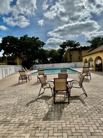 a view of a terrace with furniture and stove
