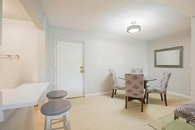 a view of a livingroom with furniture and a chair