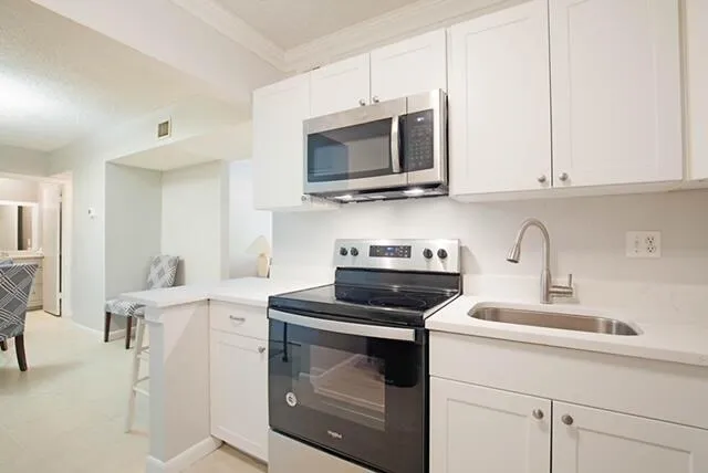a kitchen with a stove and a microwave