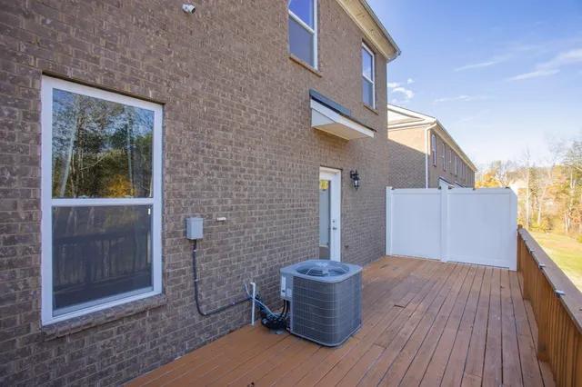 a view of a house with backyard and glass door