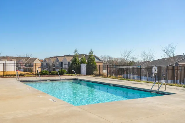 a view of a swimming pool with an outdoor seating