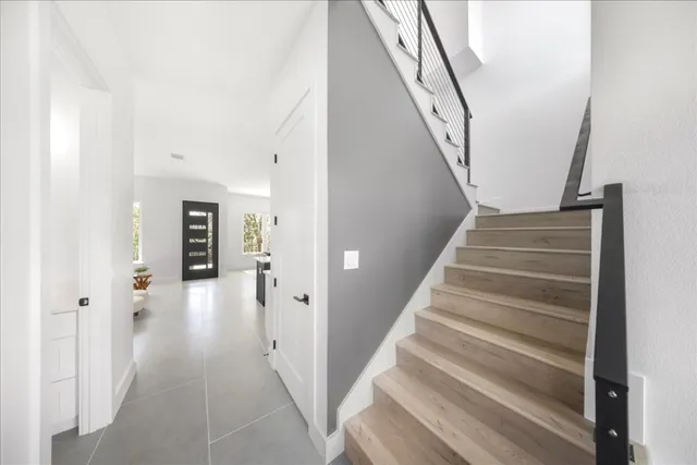 a kitchen with a sink stainless steel appliances and window