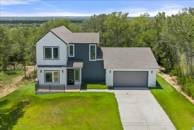 front view of a house with a yard