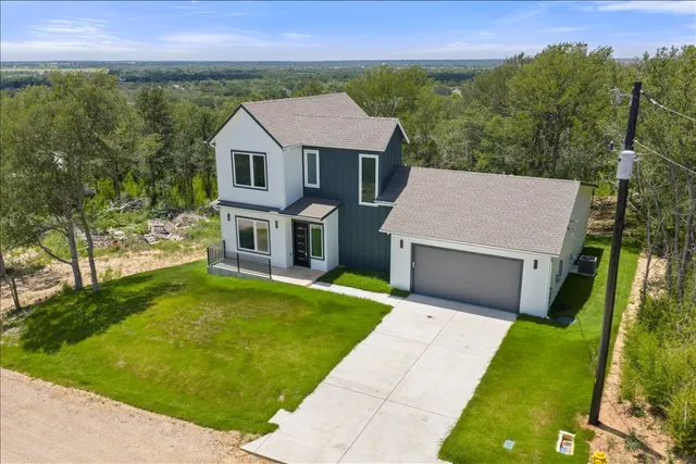 front view of a house with a yard