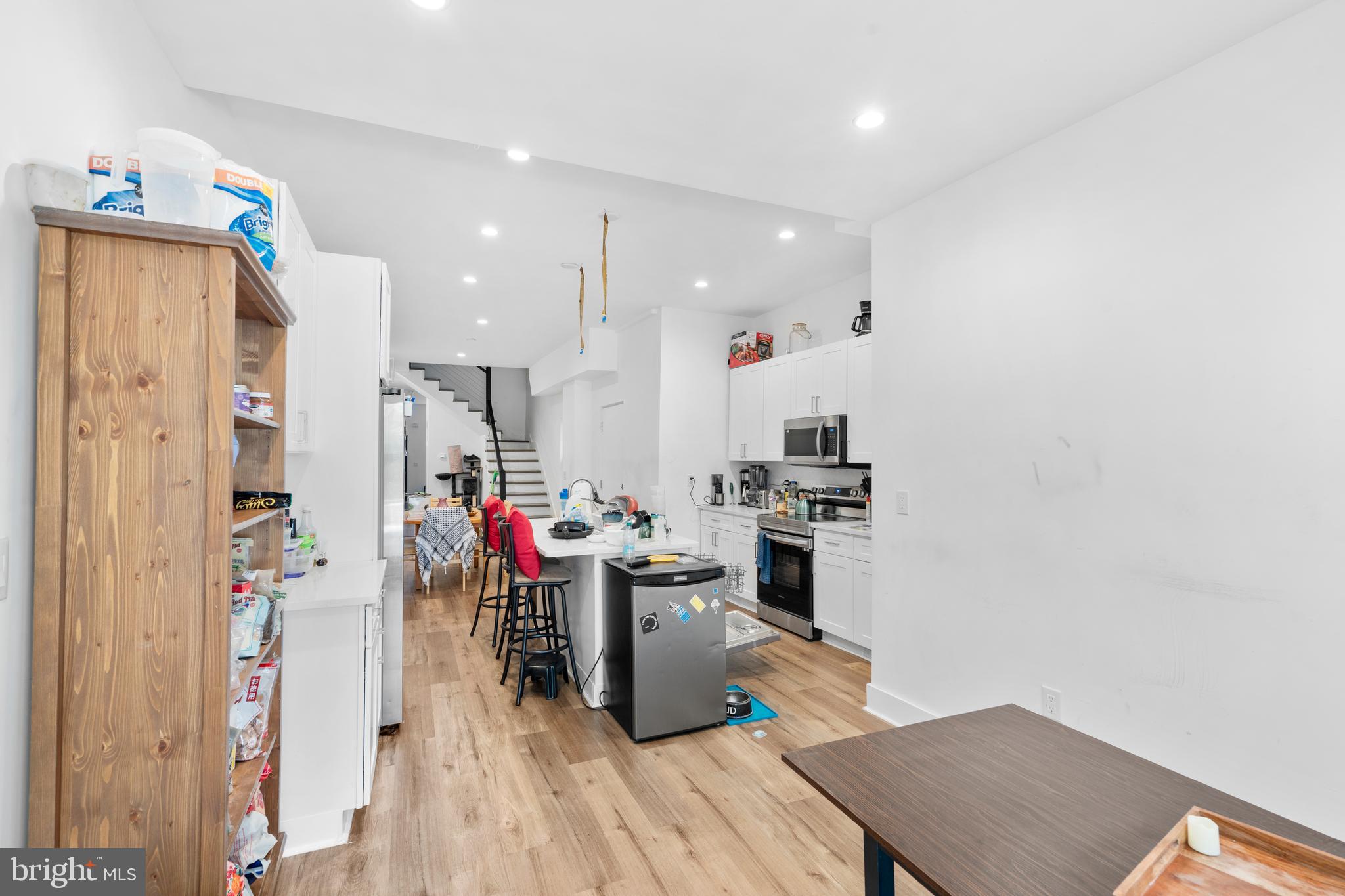 952 North 5th Street Philadelphia, PA 19123 - Photo 18 of 49 a room with stainless steel appliances lots of wooden furniture