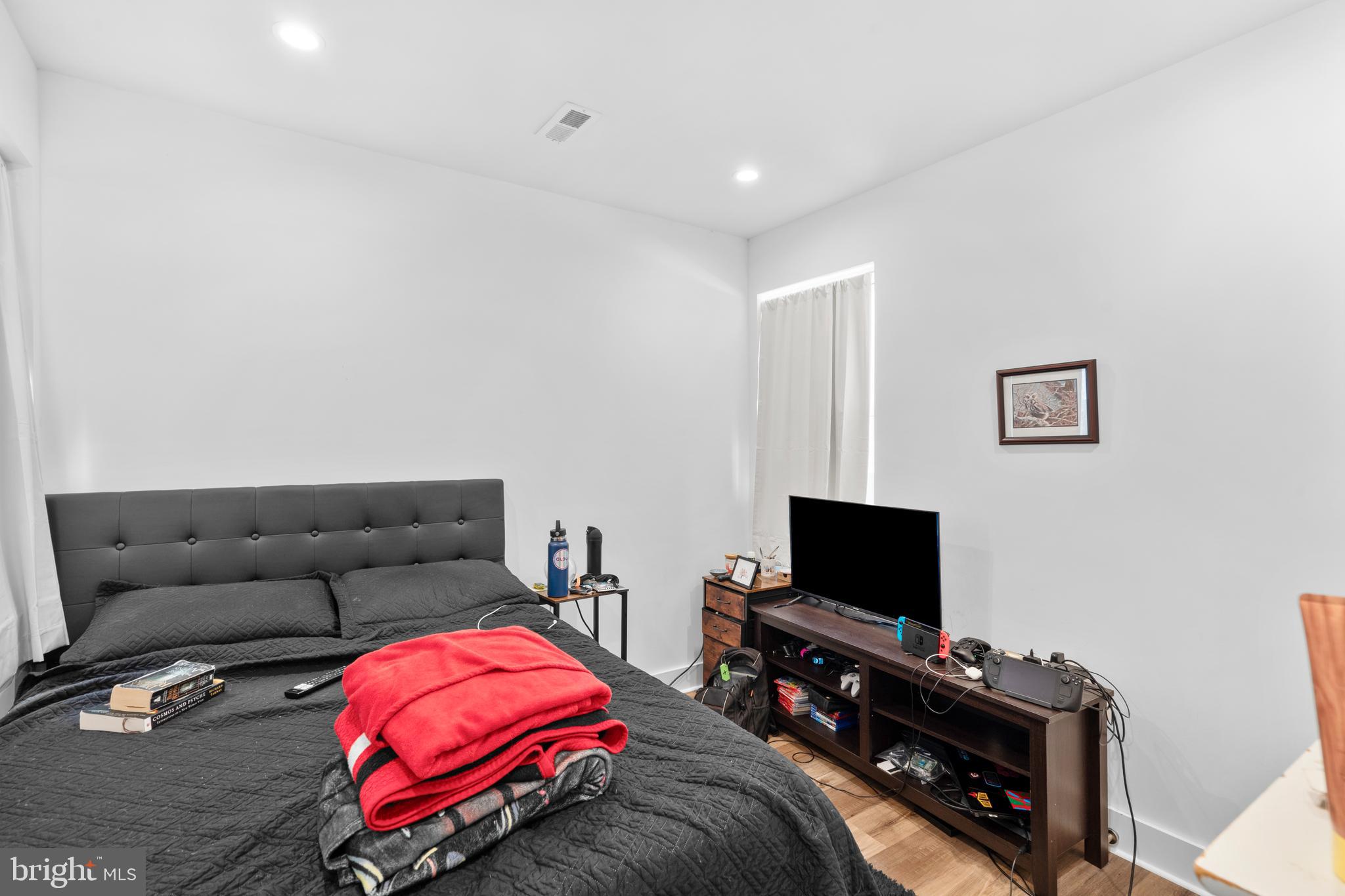 952 North 5th Street Philadelphia, PA 19123 - Photo 24 of 49 a living room with furniture and a flat screen tv