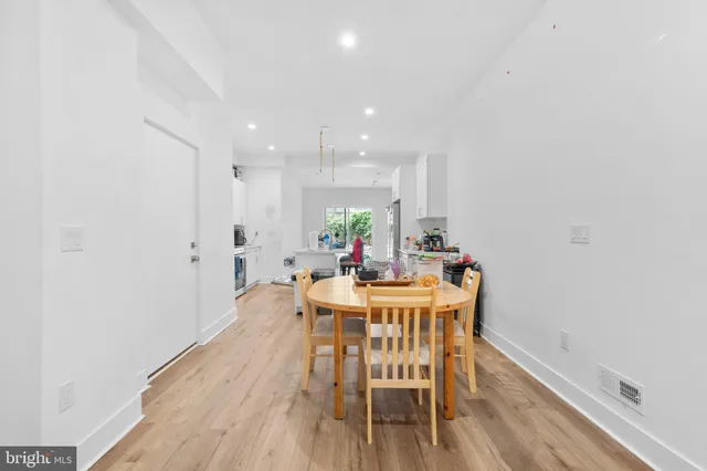a view of a pathway with wooden fence