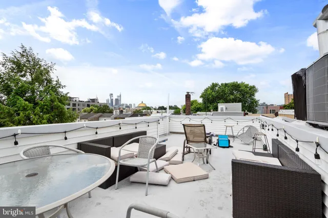 a view of a terrace with furniture