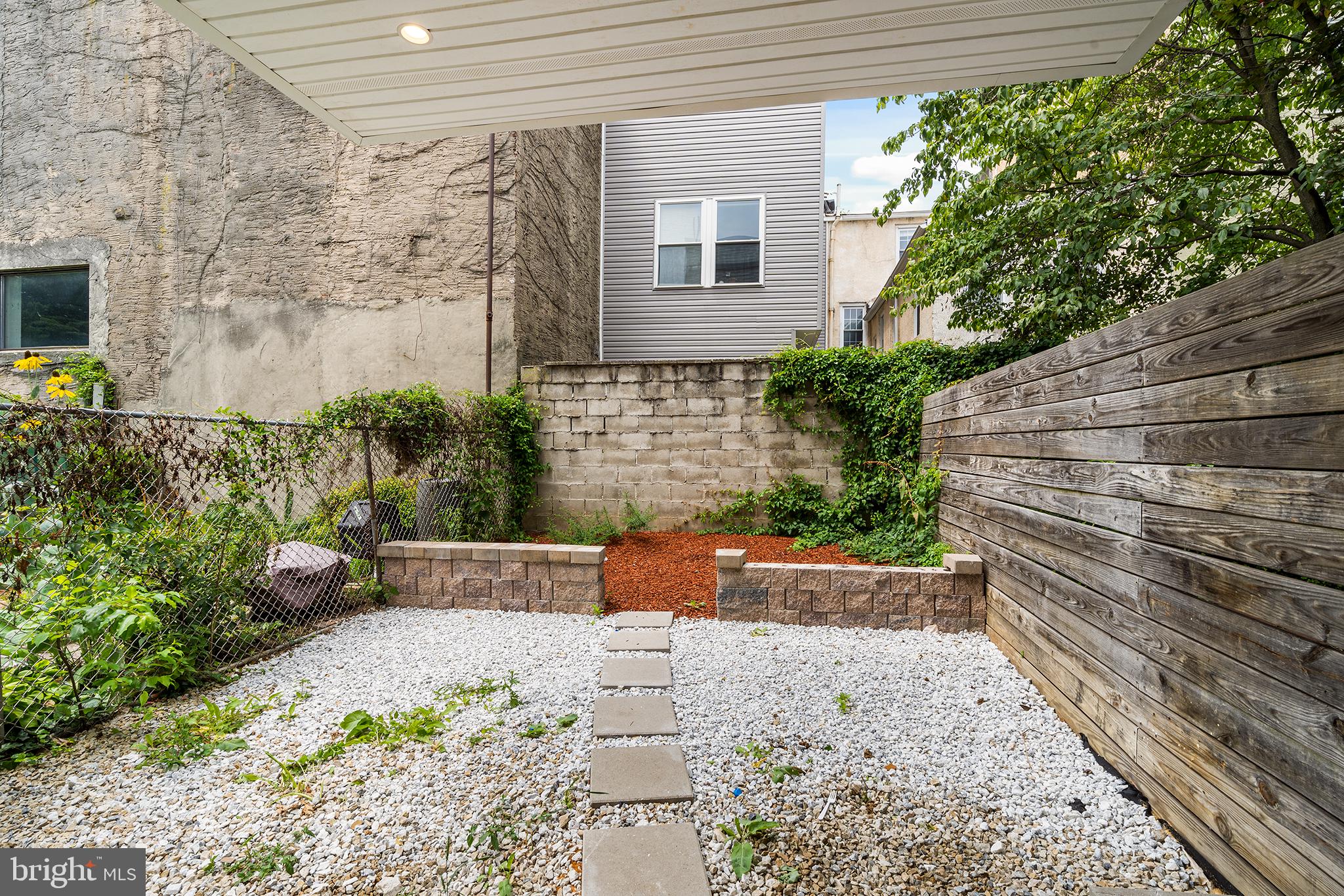 952 North 5th Street Philadelphia, PA 19123 - Photo 41 of 49 a view of brick house with potted plants