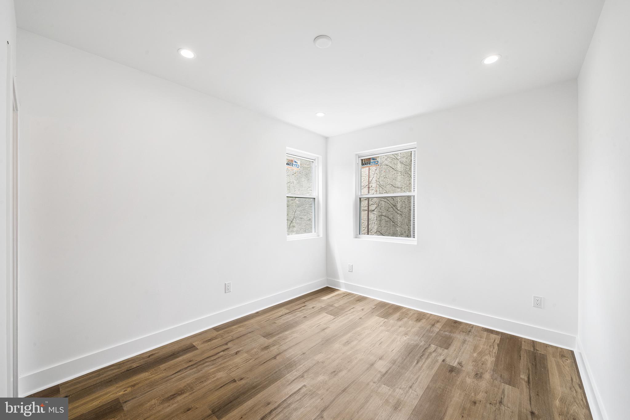952 North 5th Street Philadelphia, PA 19123 - Photo 43 of 49 an empty room with wooden floor and windows