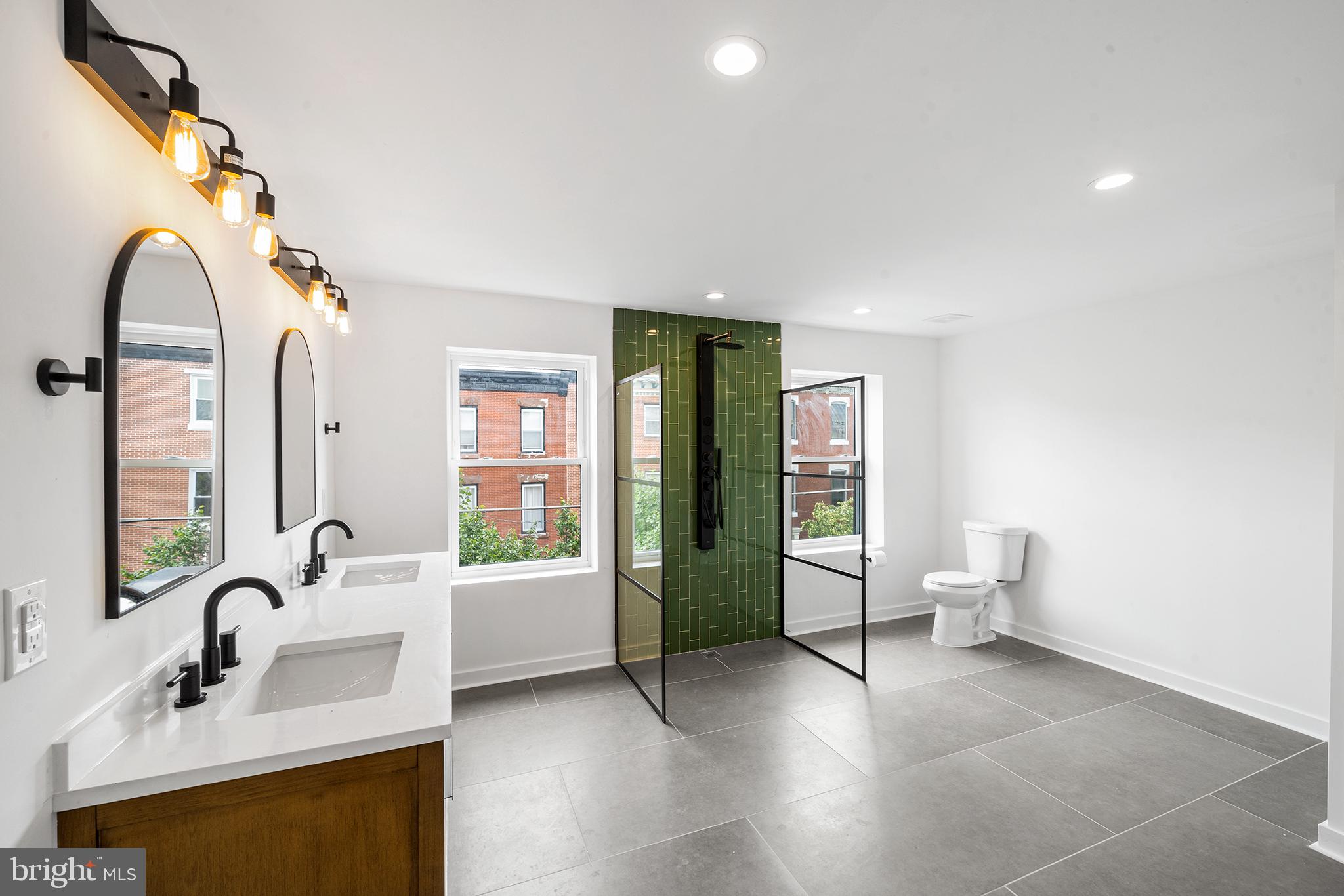 952 North 5th Street Philadelphia, PA 19123 - Photo 45 of 49 a bathroom with a sink and mirror with bathtub