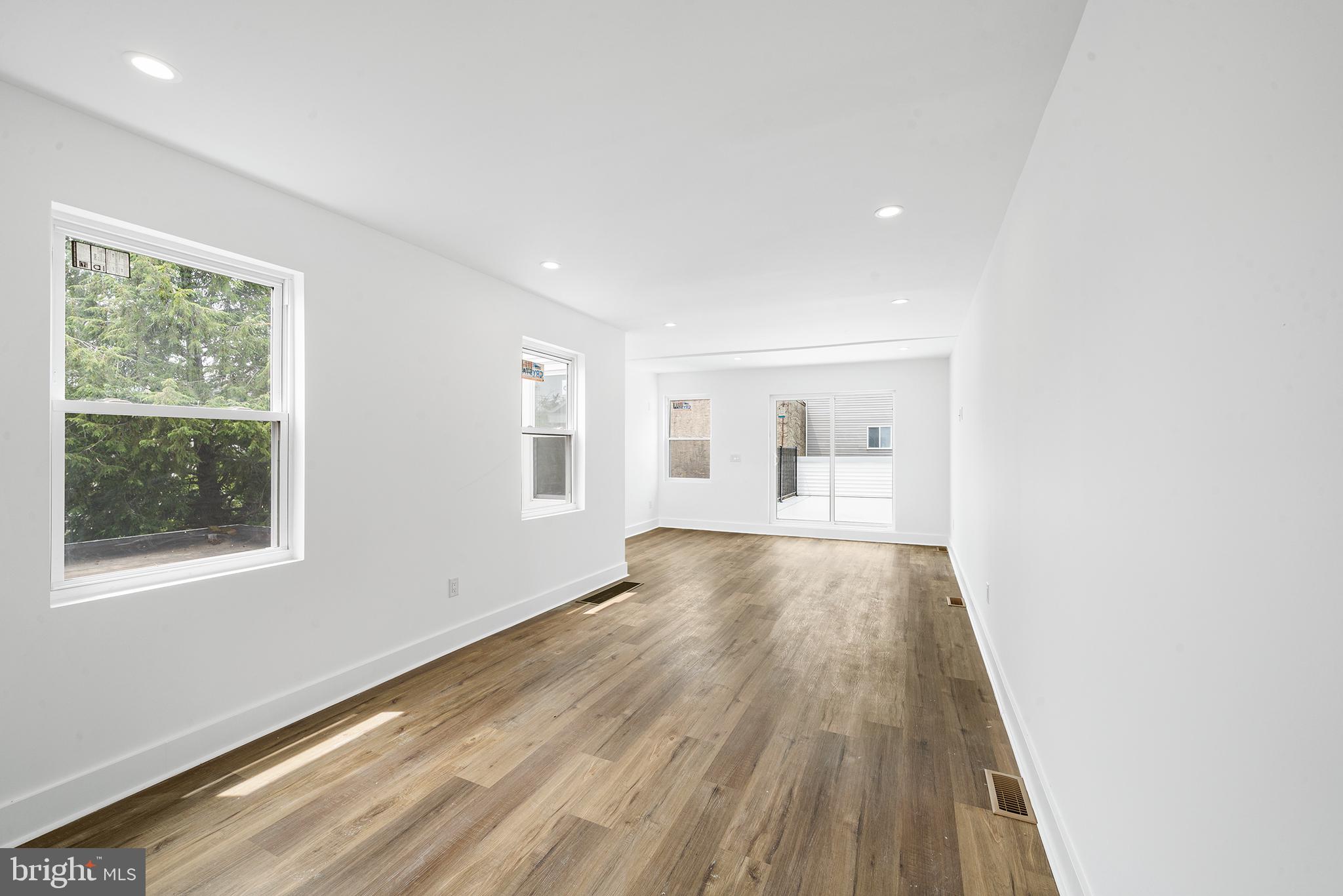 952 North 5th Street Philadelphia, PA 19123 - Photo 47 of 49 a view of an empty room with wooden floor and a window