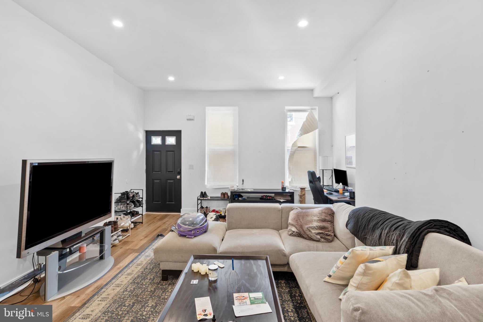 952 North 5th Street Philadelphia, PA 19123 - Photo 8 of 49 a living room with furniture and a flat screen tv