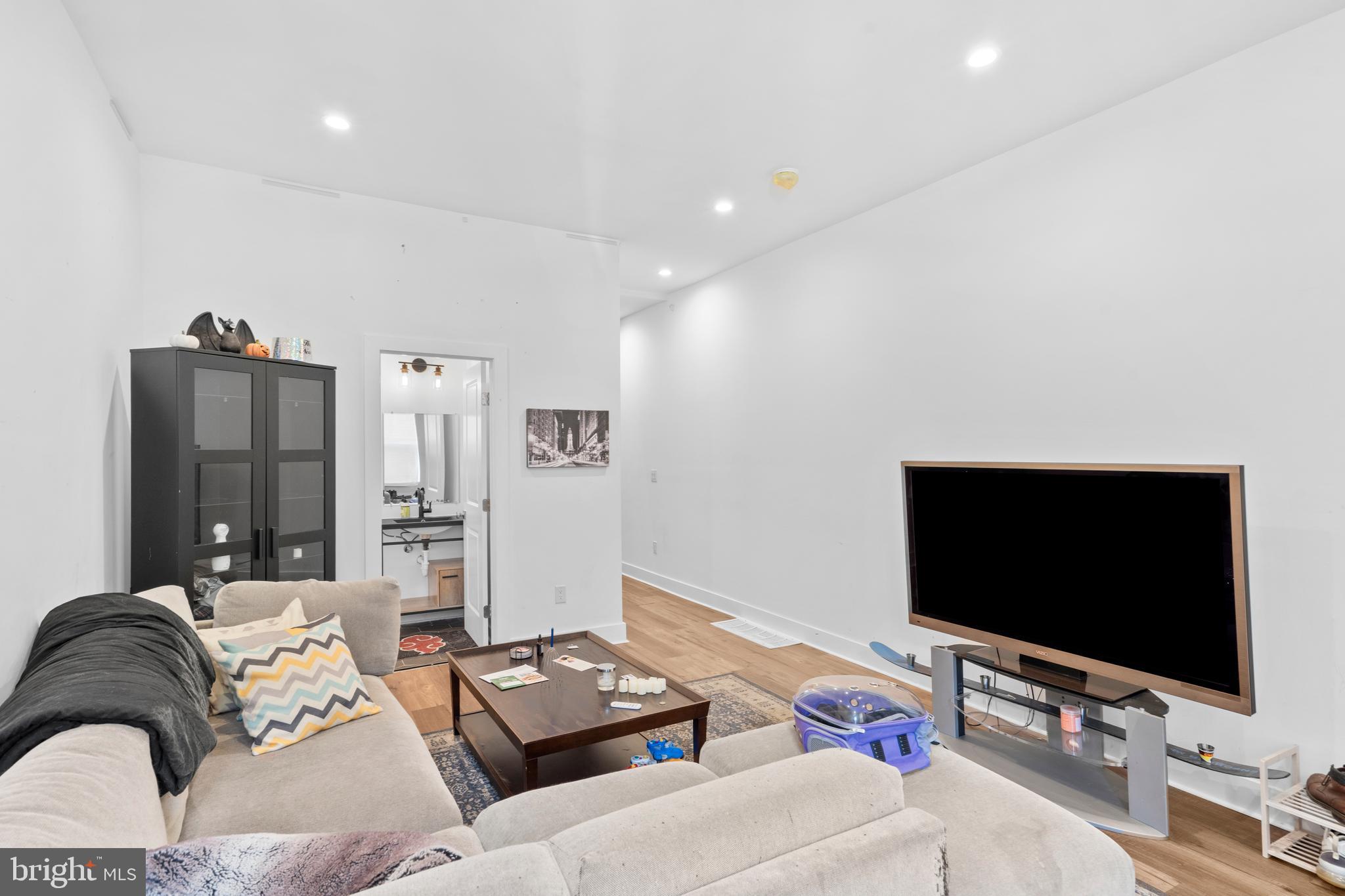 952 North 5th Street Philadelphia, PA 19123 - Photo 10 of 49 a living room with furniture and a flat screen tv