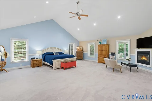 a bedroom with furniture and a fireplace