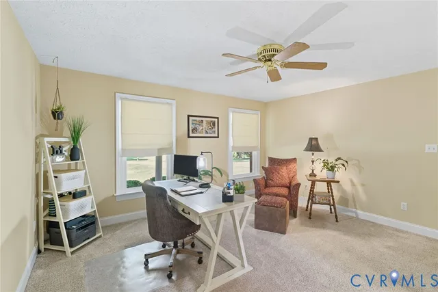 a workspace with furniture and window