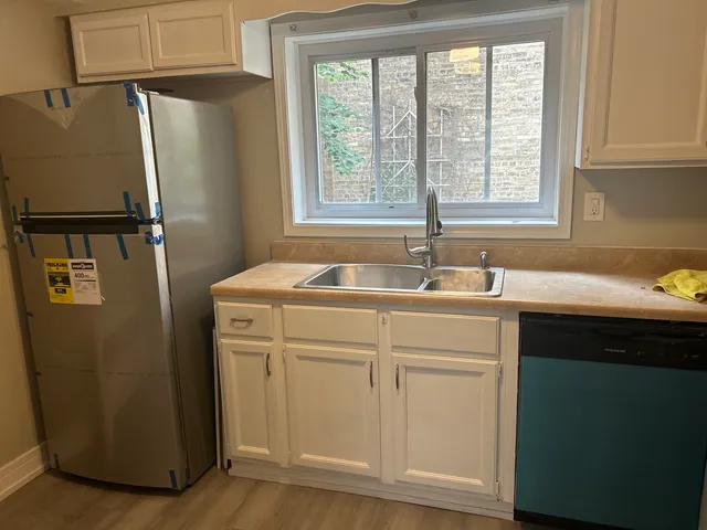 a bathroom with a sink and a window