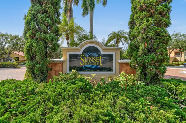 a front view of a house with a yard and fountain