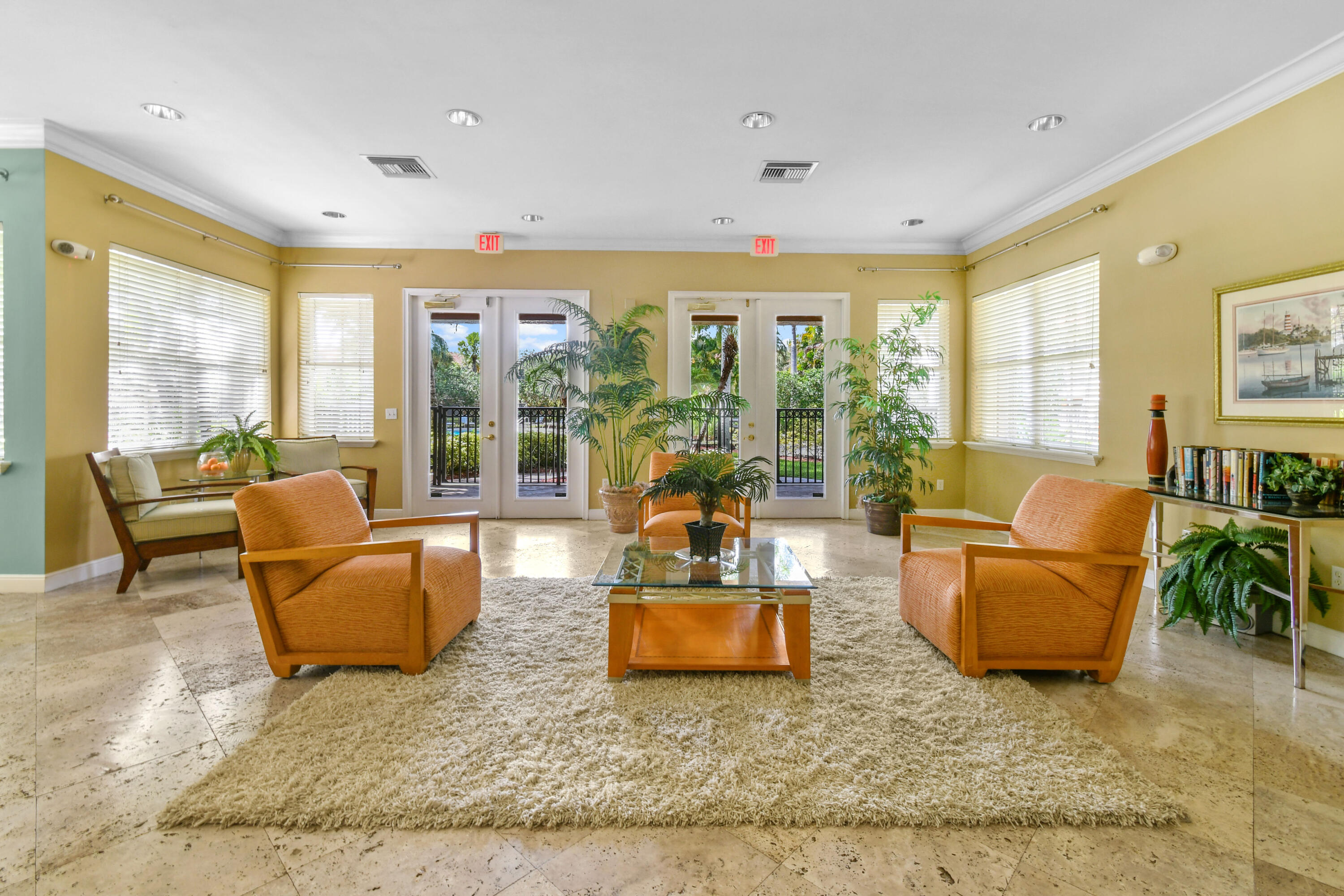 10354 Fox Trail Road South, Unit 1505 West Palm Beach, FL 33411 - Photo 26 of 76 a living room with furniture and floor to ceiling windows