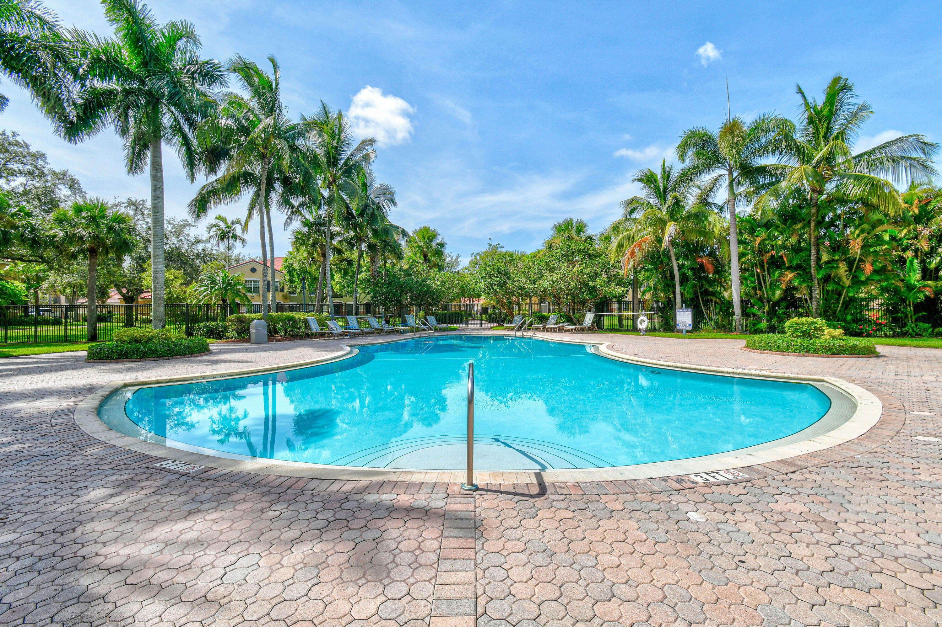 10354 Fox Trail Road South, Unit 1505 West Palm Beach, FL 33411 - Photo 27 of 76 a view of a swimming pool with a yard