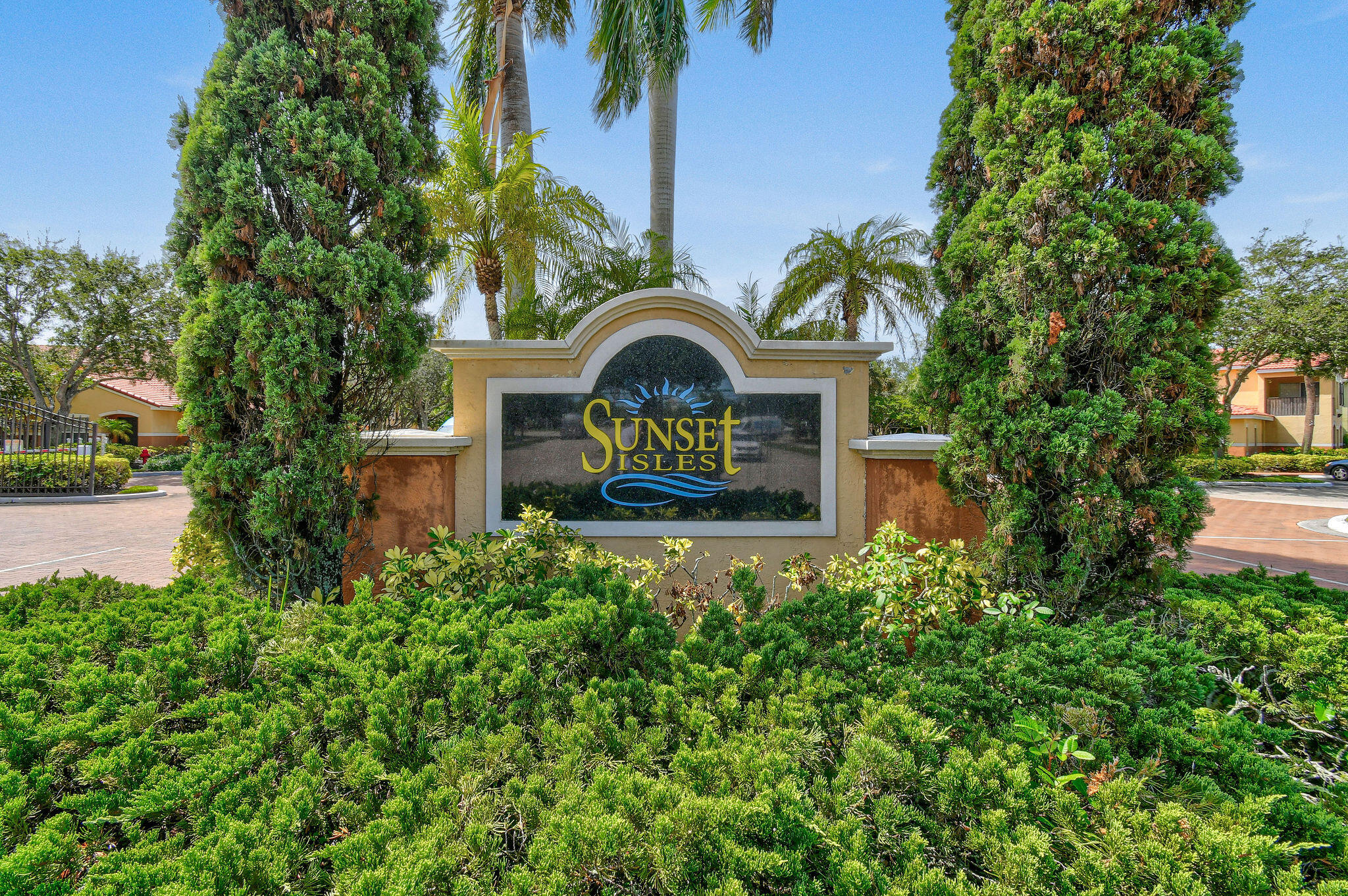 10354 Fox Trail Road South, Unit 1505 West Palm Beach, FL 33411 - Photo 35 of 76 a front view of a house with a yard and fountain