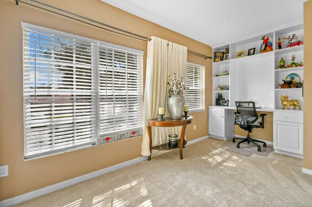 a view of a swimming pool with a yard