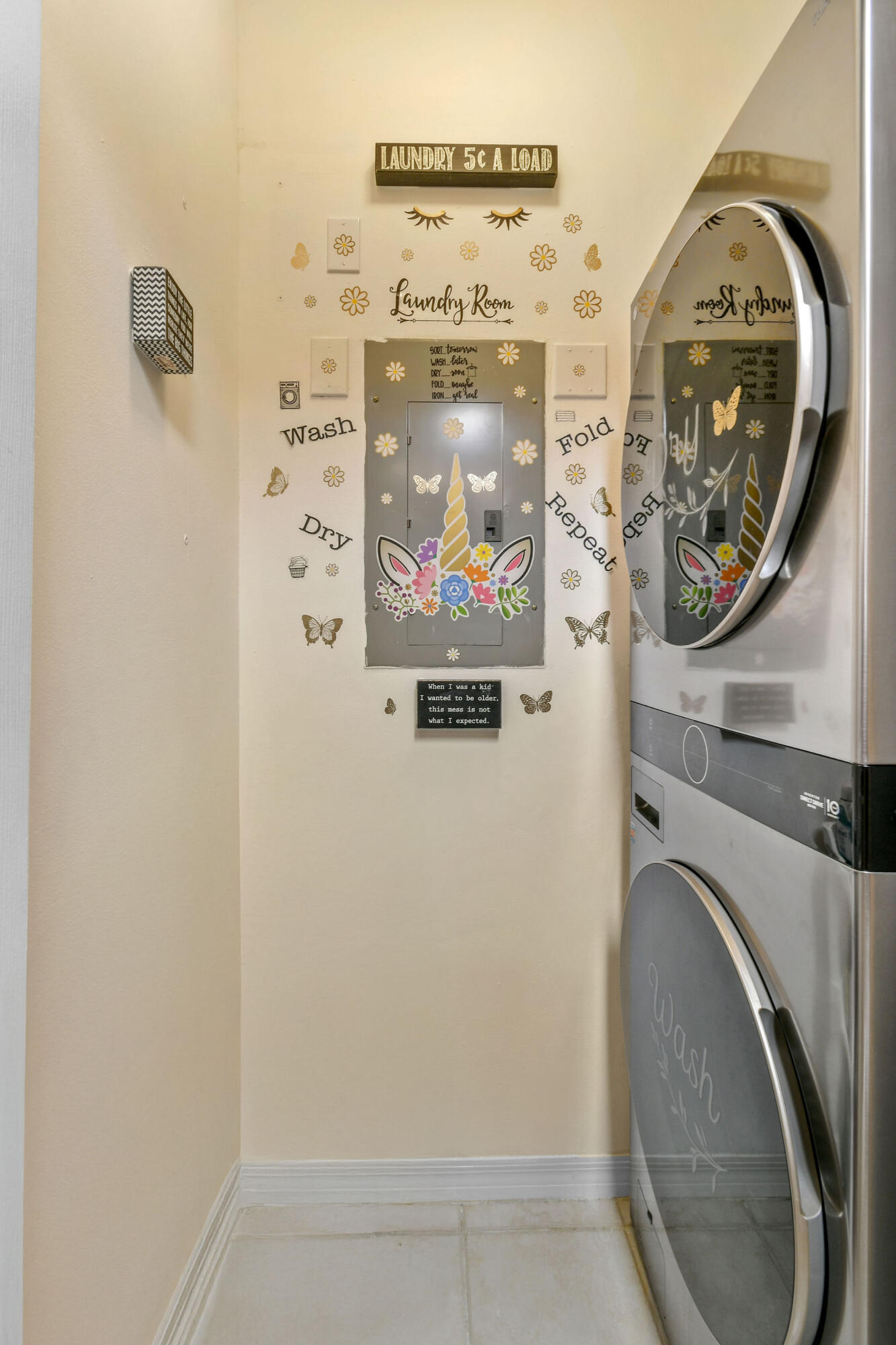10354 Fox Trail Road South, Unit 1505 West Palm Beach, FL 33411 - Photo 58 of 76 a close view of a utility room with dryer and washer