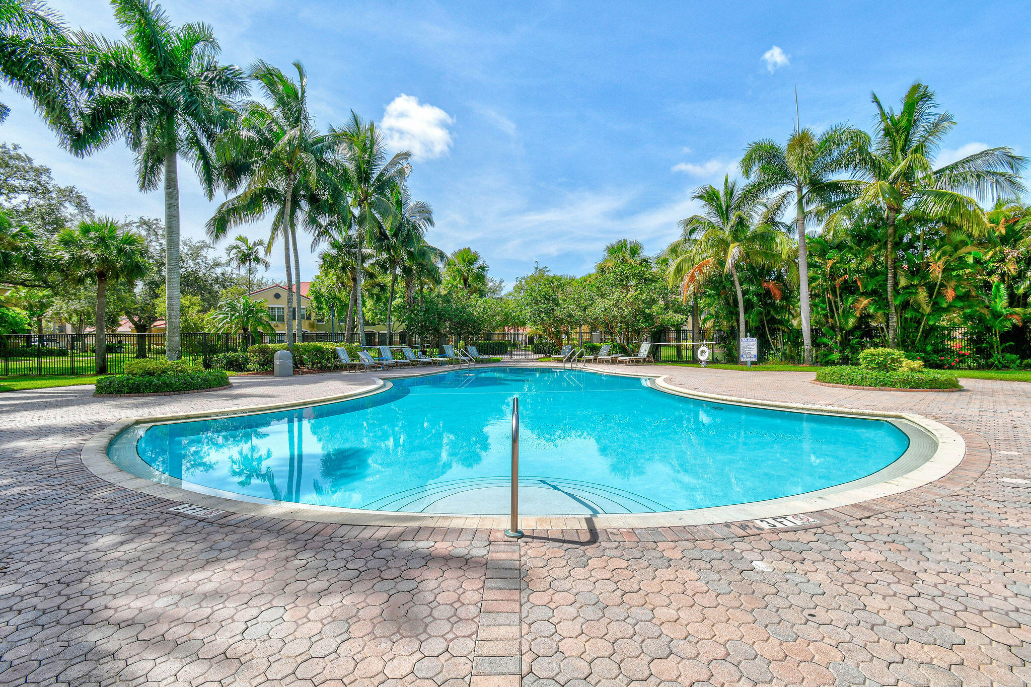 10354 Fox Trail Road South, Unit 1505 West Palm Beach, FL 33411 - Photo 69 of 76 a view of a swimming pool with a yard