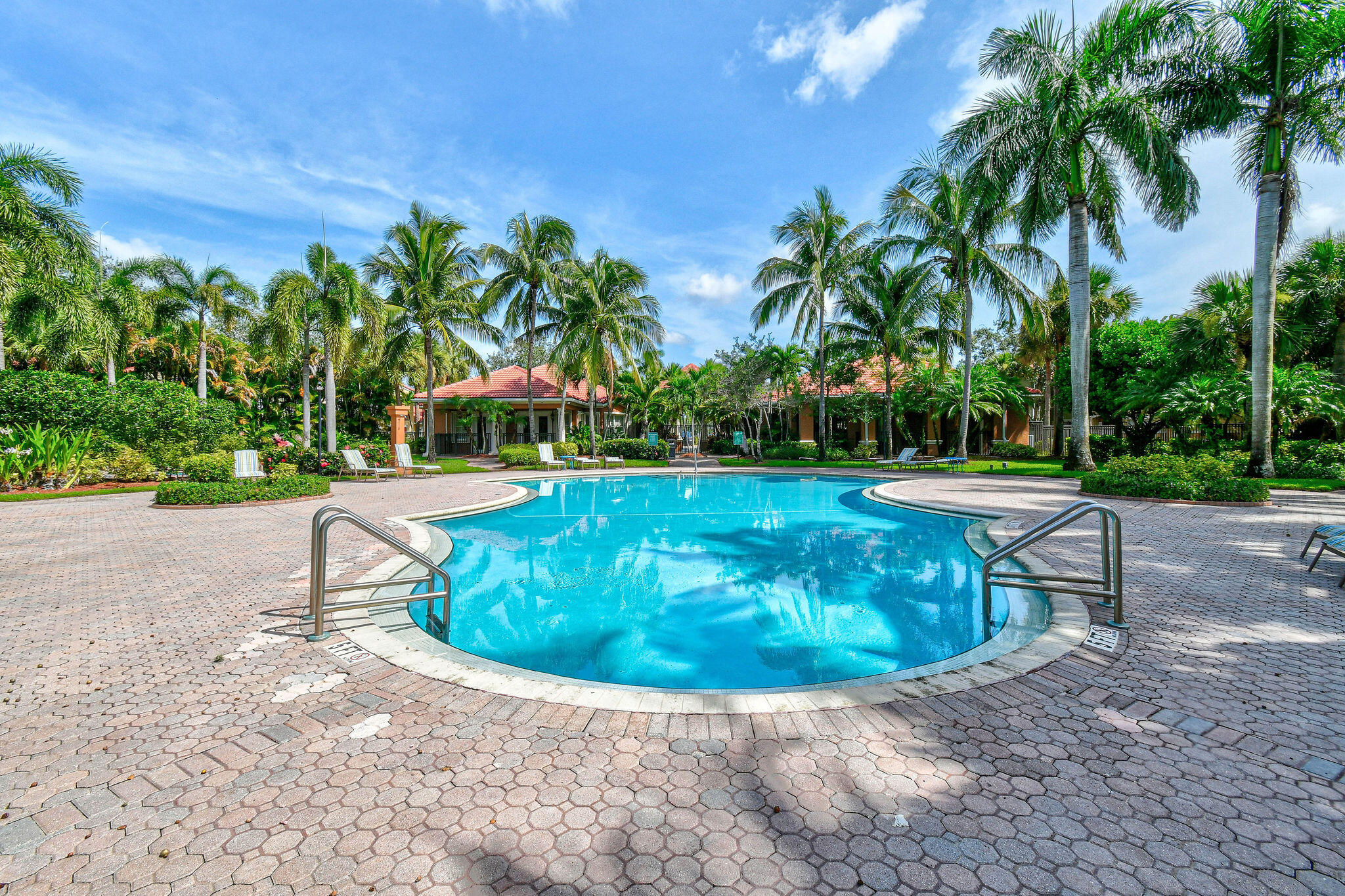 10354 Fox Trail Road South, Unit 1505 West Palm Beach, FL 33411 - Photo 70 of 76 a view of a swimming pool with a yard
