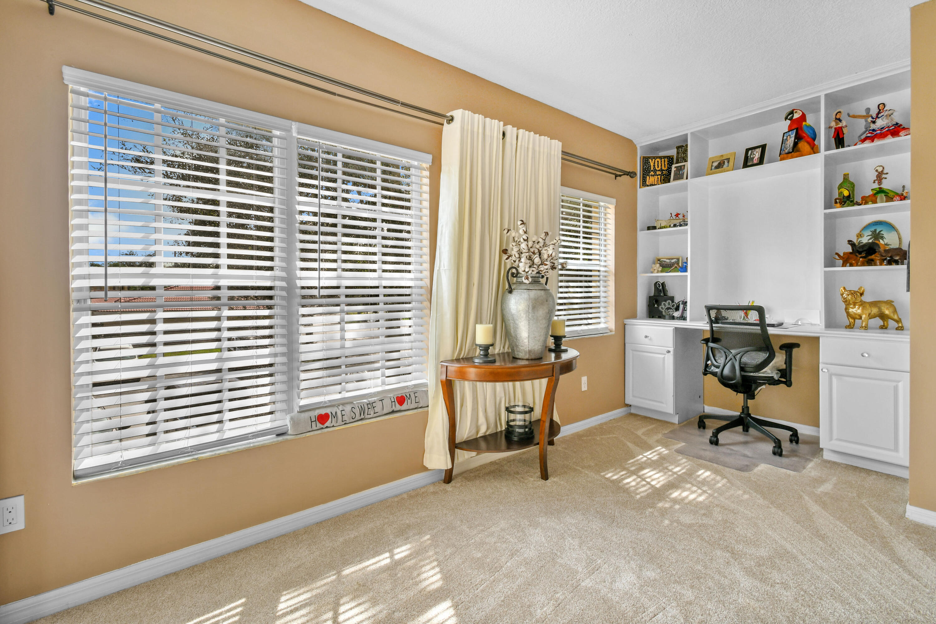 10354 Fox Trail Road South, Unit 1505 West Palm Beach, FL 33411 - Photo 8 of 76 a view of a workspace with furniture and a window