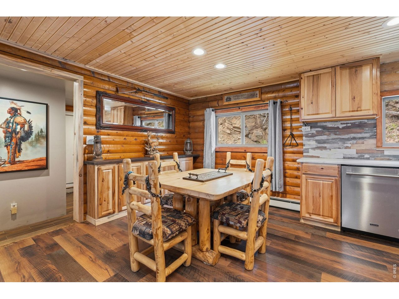 12743 Rist Canyon Road Bellvue, CO 80512 - Photo 15 of 49 a view of a dining room with furniture window and wooden floor