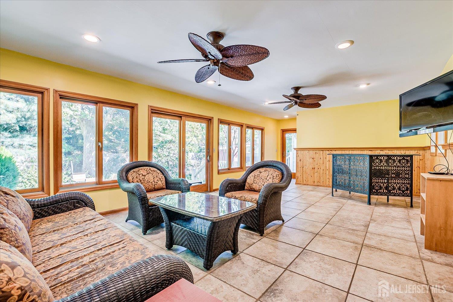 39 Rayle Court Metuchen, NJ 08840 - Photo 16 of 29 a living room with patio furniture and a large window