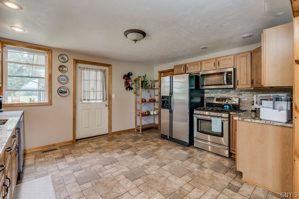 3884 Deer River Road Denmark, NY 13619 - Photo 26 of 47 Kitchen / Door to Garage 1