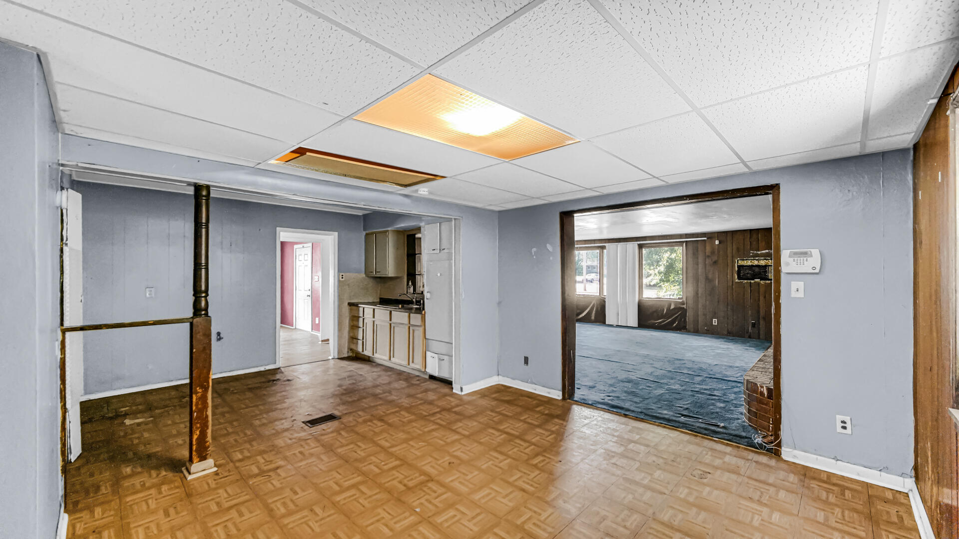 1240 Benton Street Gary, IN 46403 - Photo 3 of 4 a view of a hallway with wooden floors and livingroom view