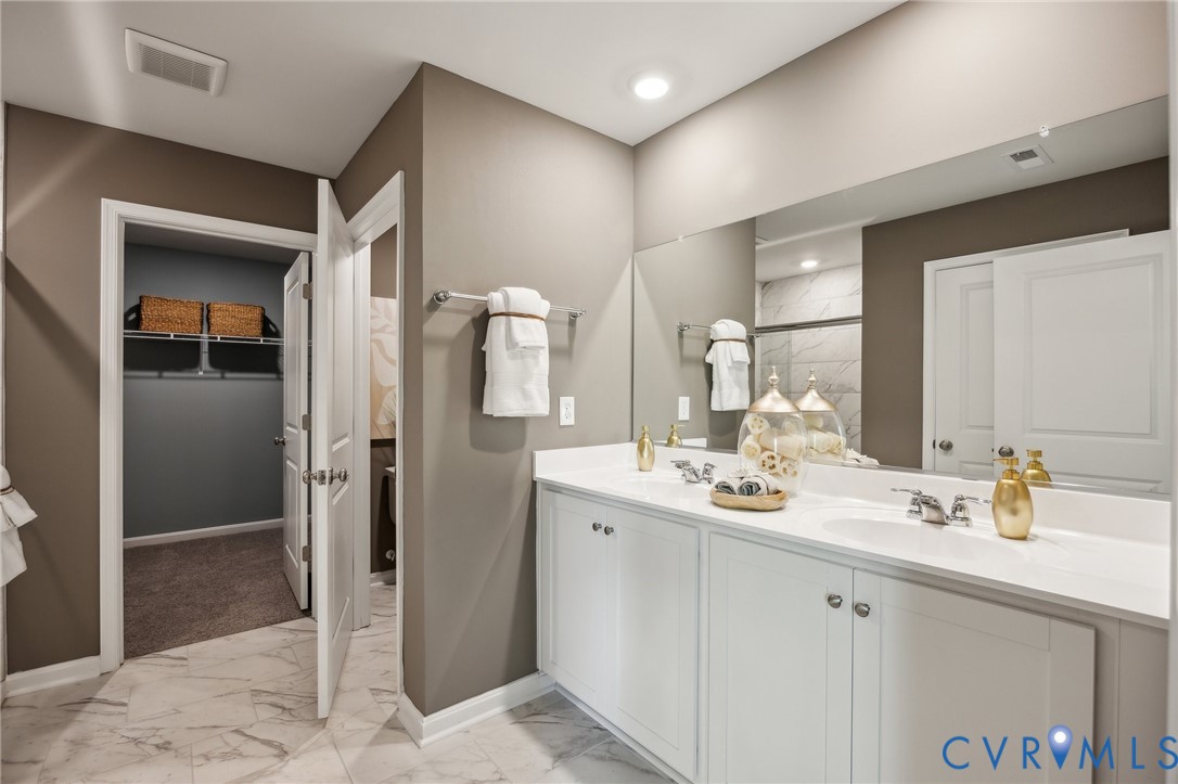 211 Happy Valley Road Keswick, VA 22947 - Photo 29 of 31 a bathroom with a sink and a mirror