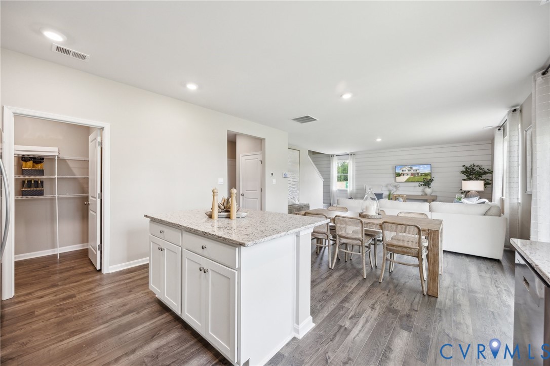 211 Happy Valley Road Keswick, VA 22947 - Photo 7 of 31 a kitchen with a sink cabinets and wooden floor