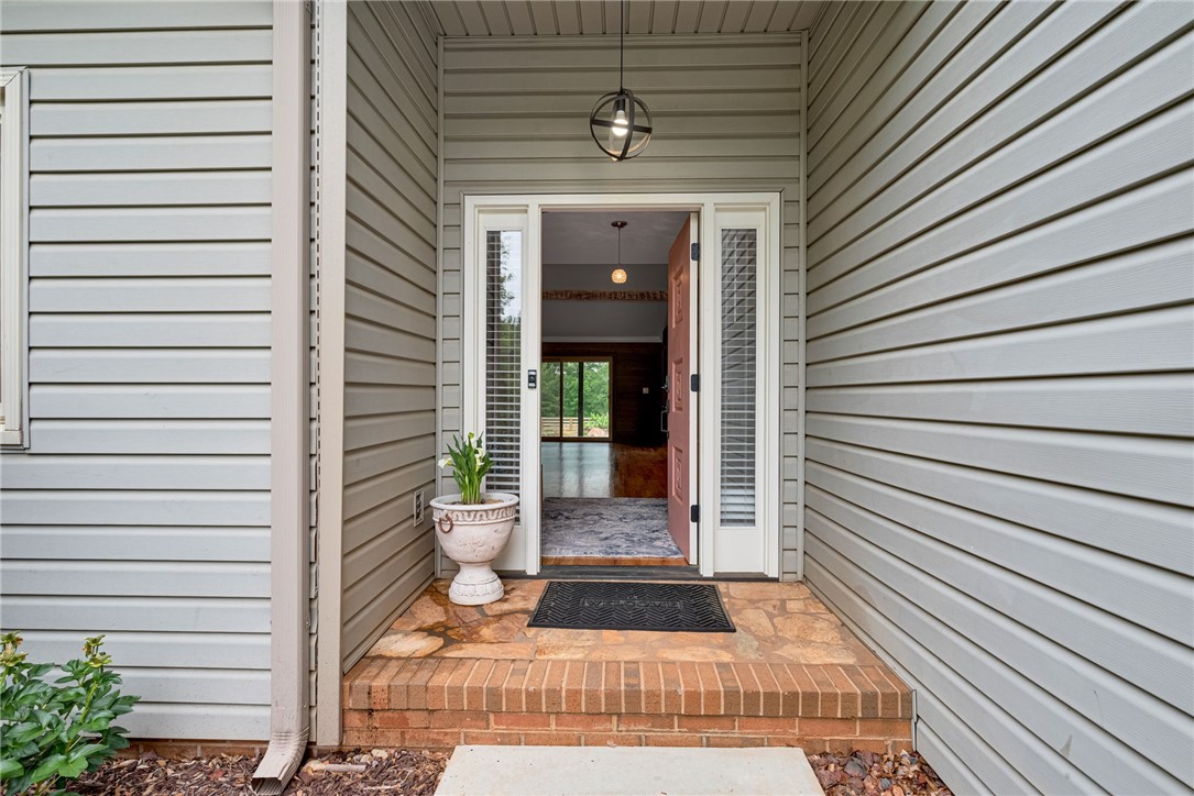 433 Latham Road Easley, SC 29640 - Photo 16 of 50 A welcoming entry, with a classic red door, hints at the spacious interiors beyond.