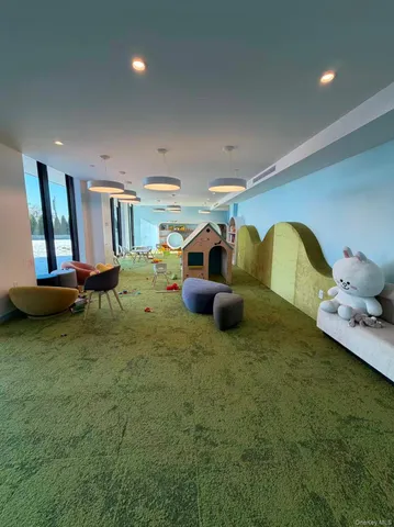 a large room with lots of table and chairs