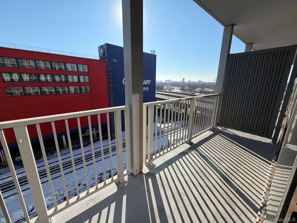 a view of balcony with wooden floor