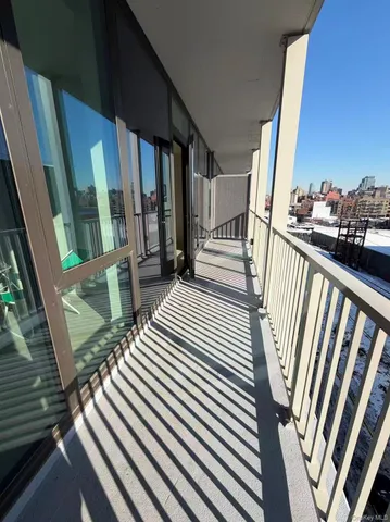 a view of balcony with wooden floor