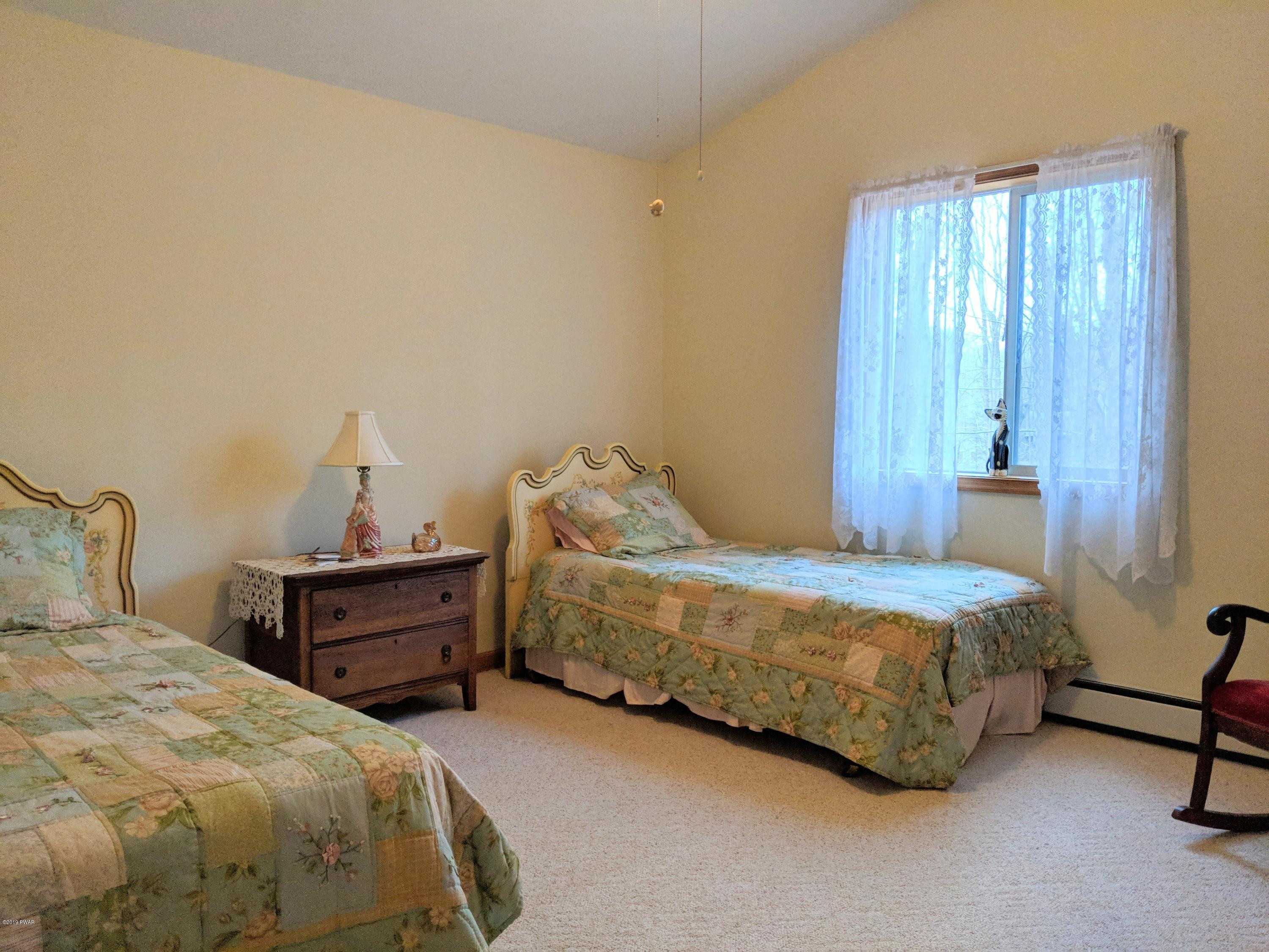 2653 Boulder Road Lake Ariel, PA 18436 - Photo 31 of 45 a bedroom with a bed and a window