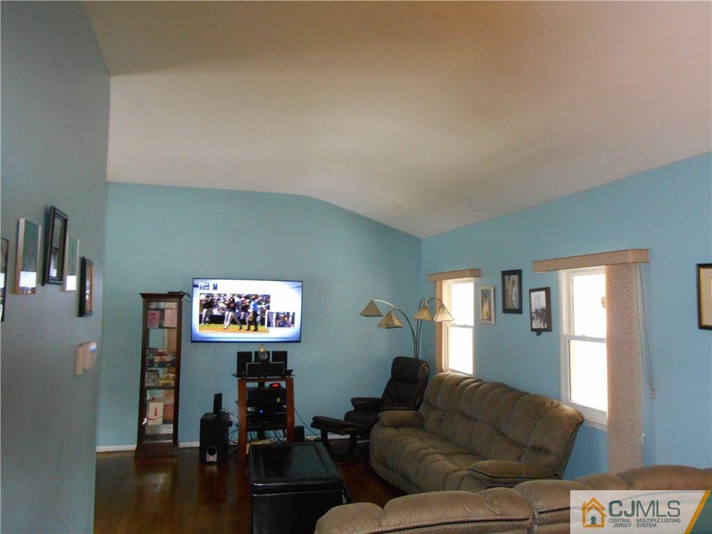 17 Kingsbridge Road Somerset, NJ 08873 - Photo 2 of 11 a living room with furniture and wooden floor