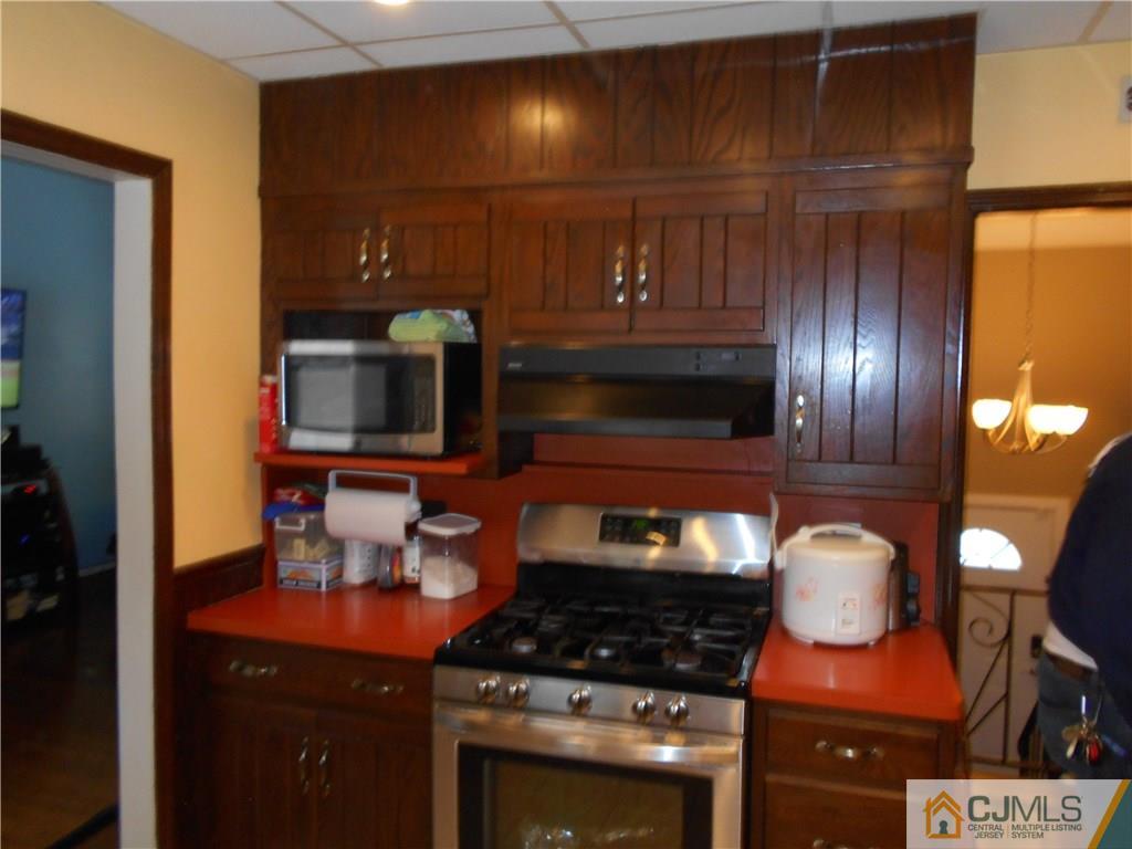 17 Kingsbridge Road Somerset, NJ 08873 - Photo 11 of 11 a kitchen with stainless steel appliances granite countertop a stove and a sink