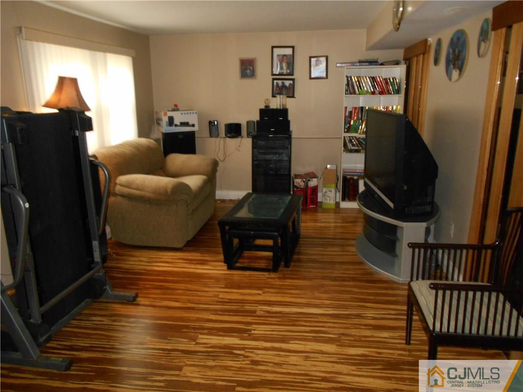 17 Kingsbridge Road Somerset, NJ 08873 - Photo 7 of 11 a living room with furniture and a wooden floor